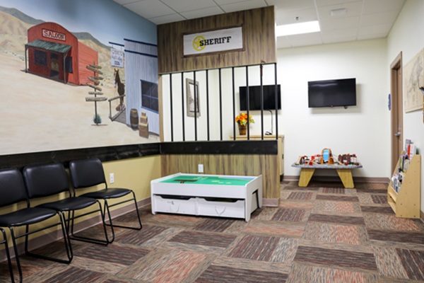 Children's waiting room with Western-themed decor.