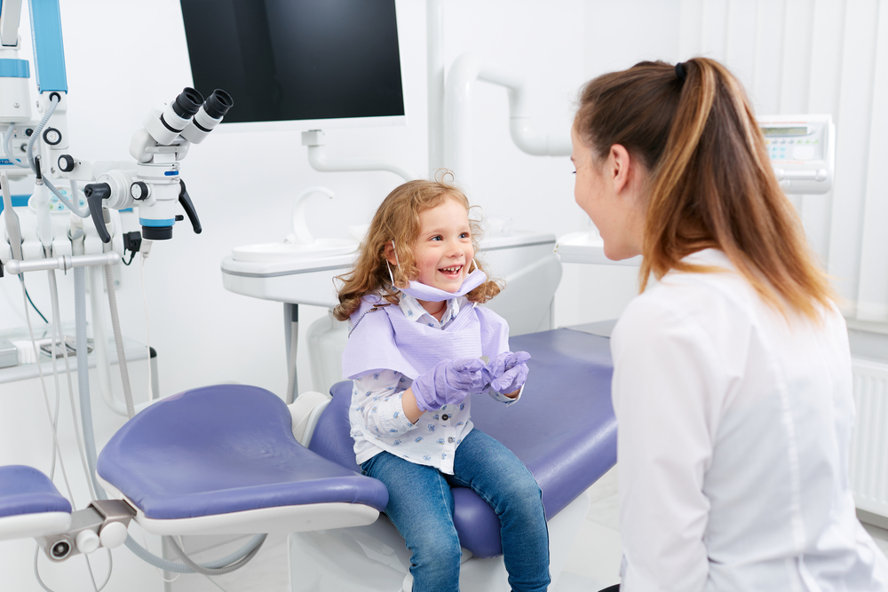 Child smiling at dentist's office.