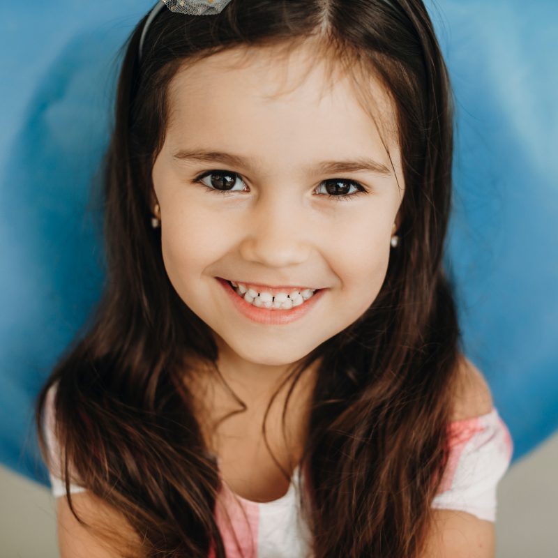 Smiling girl with long hair and headband