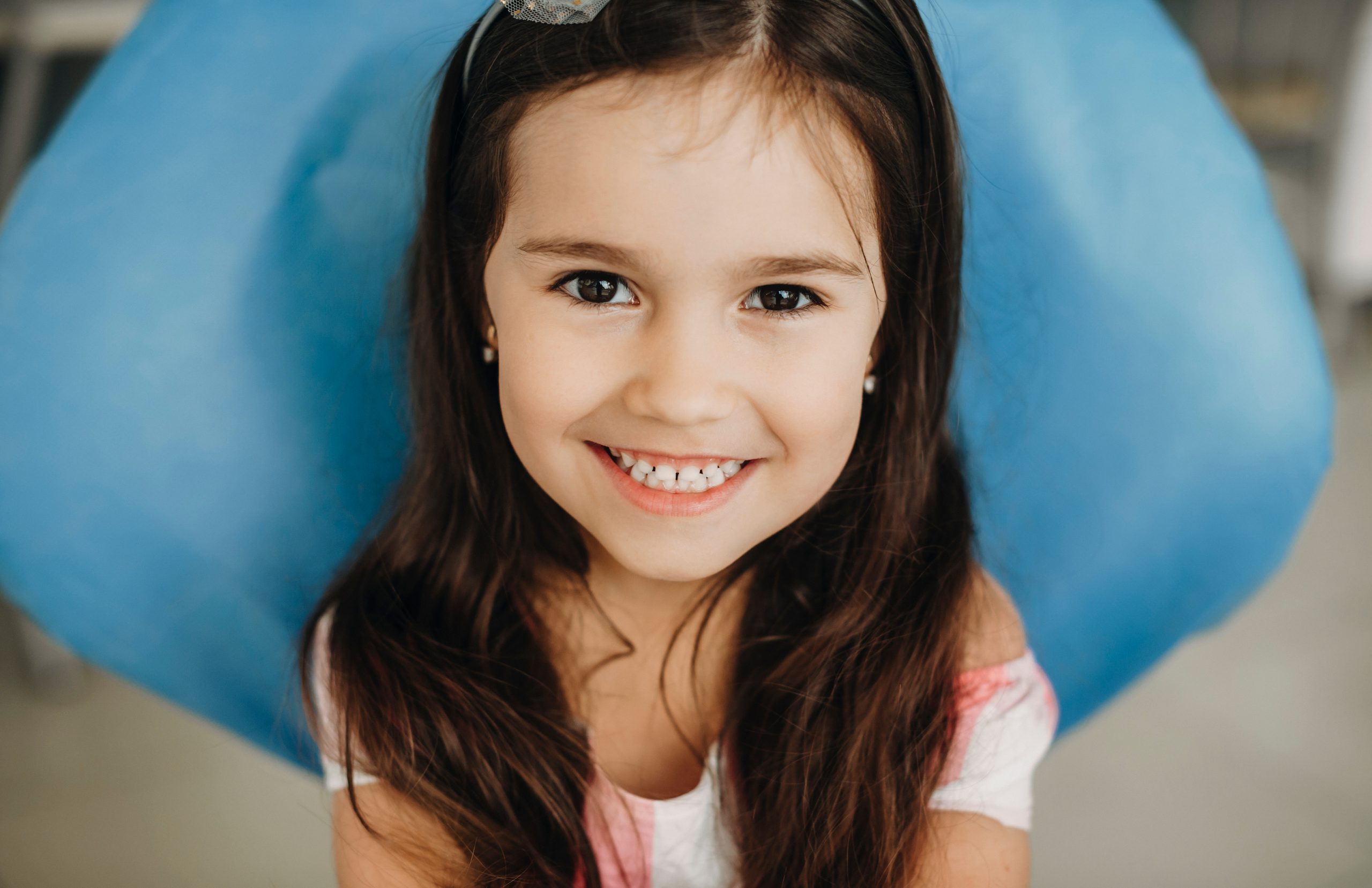 Smiling girl with long hair and headband